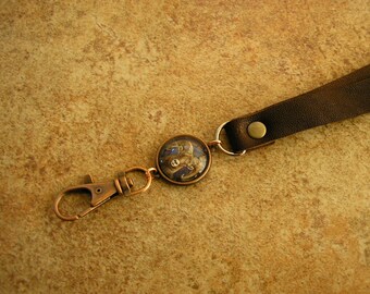 ID Lanyard, Ram, coco leather and charm lanyard, strap is 36" long with a charm and a spring clip.