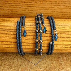 Montana Blue Blue Czech glass seed beads and black pearls on memory wire bracelet 60mm across 3 bracelets with a total of 9 wraps image 2