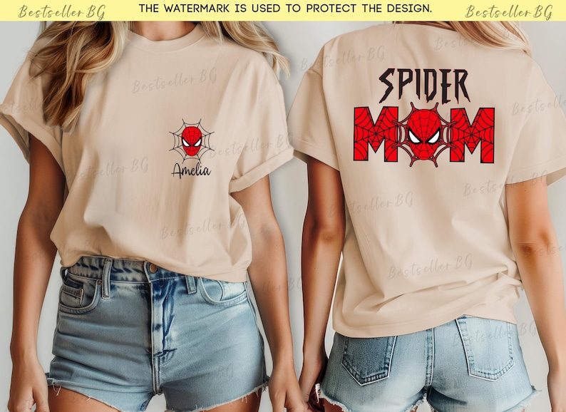 Puede incluir: Camiseta beige con un dise&ntilde;o de Spider-Man. La parte delantera presenta un dise&ntilde;o de telara&ntilde;a roja y negra con una cara de ara&ntilde;a y el nombre "Amelia". La parte trasera de la camiseta tiene las palabras "SPIDER MOM" con una cara de ara&ntilde;a.