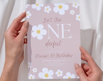 May include: Pink and white birthday invitation with a daisy pattern. The text reads "Isn't She One Derful" and "Olivia's 1st Birthday".