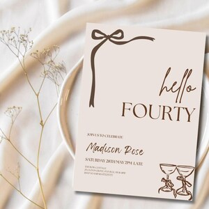 May include: A beige invitation card with brown text and a decorative bow. The words "hello FOURTY" are displayed prominently. Additional text includes "Join us to celebrate" and "Madison Rose". Two champagne glasses are illustrated at the bottom.