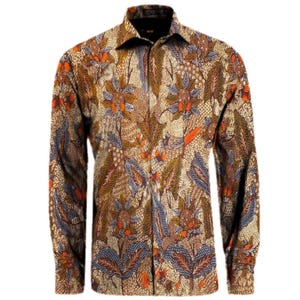 May include: A long-sleeved button-down shirt with a detailed floral pattern in shades of brown, orange, and blue. The shirt has a classic collar and cuffs. The fabric appears to be a woven material.