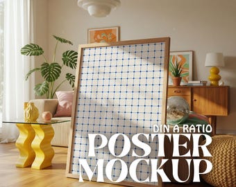 May include: A white poster mockup with a blue grid pattern and the text "DIN A RATIO POSTER MOCKUP" in a white sans-serif font. The poster is leaning against a wooden frame and is in a living room setting with a yellow side table and a couch.