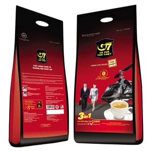 May include: Two red and black coffee bags with the text "G7 Cà Phê Thử Thiệt". The bags feature images of a helicopter, a cup of coffee, and people. The bags also have text in Vietnamese.
