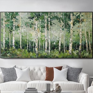 May include: A large rectangular framed painting depicts a forest scene. The artwork features tall, slender birch trees with white bark and green foliage. The painting's color palette includes shades of green, white, and brown, creating a natural and serene atmosphere.