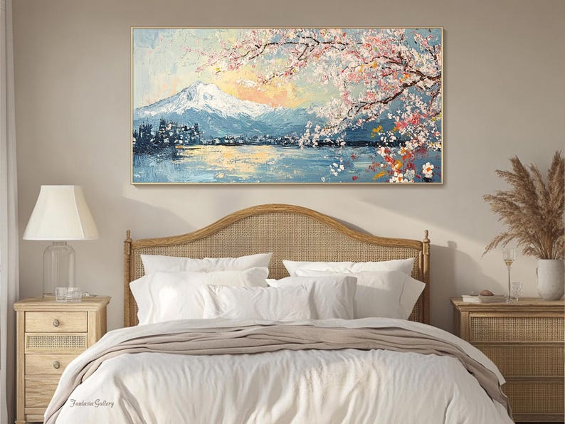 May include: A painting of a mountain range with a lake in the foreground. The mountain range is covered in snow and the lake is surrounded by trees. The sky is blue and there are pink and white flowers in the upper right corner of the painting.