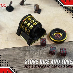 May include: Black and gold dice storage container with a combination lock design, a dice tray, and three red dice. The text "STORE DICE AND TOKENS" is visible. The container fits 2 standard D20 or 3 16mm D6 dice.