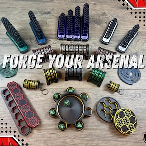 May include: A collection of gaming accessories in various colors, including dice trays, dice towers, and combination lock boxes. The text "FORGE YOUR ARSENAL" is displayed across the image. The accessories are arranged on a wooden surface.