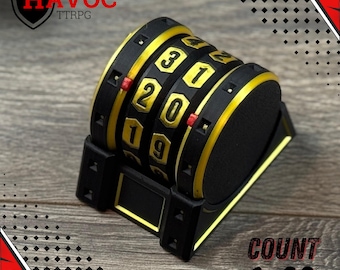 May include: A black and gold TTRPG counter with rotating number dials. The counter displays numbers from 0 to 31. The text "HAVOC TTRPG" is in the upper left corner. The text "COUNT 0-99" is in the lower right corner.