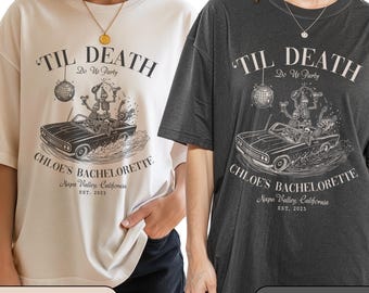 May include: Ivory and pepper-colored t-shirts with a graphic design. The design features the text "TIL DEATH Do Us Party" above a vintage car with skeleton figures. The text "CHLOE'S BACHELORETTE Napa Valley, California EST. 2025" is below the car.
