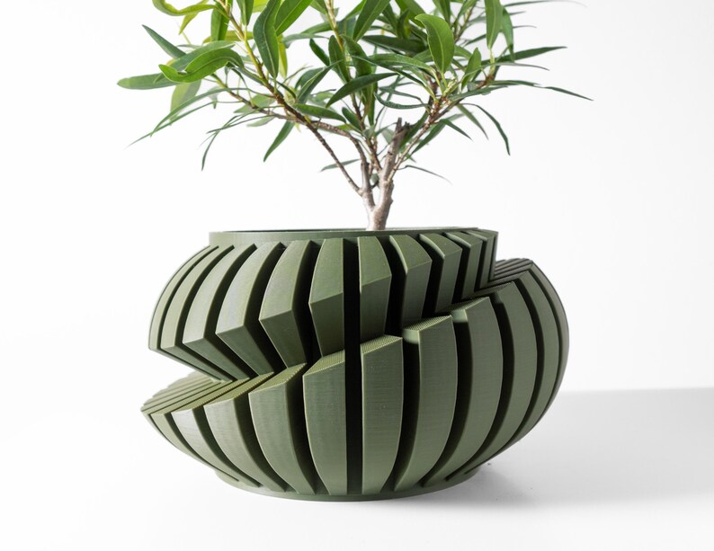 May include: A green, geometric planter with a unique, twisted design. The planter is made of a smooth, textured material and has a wide, round base.