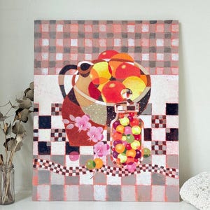 May include: A rectangular painting featuring a still life composition with a dark pitcher filled with round orange and yellow fruits, a glass jar containing colourful spheres, and pink floral accents, all set against a checkered background.