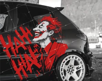 May include: Black car with a red graphic of the Joker character on the side. The graphic includes the words "HA HA HA" in red. The car has white rims and a black spoiler.