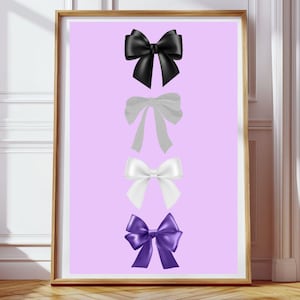 Puede incluir: Cuatro lazos en fila sobre un fondo morado claro. El lazo superior es negro, el segundo es gris claro, el tercero es blanco y el lazo inferior es morado.