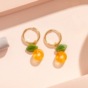 CLEMMIE Orange Charm Hoop Earrings - Fruity charms on gold plated hoops