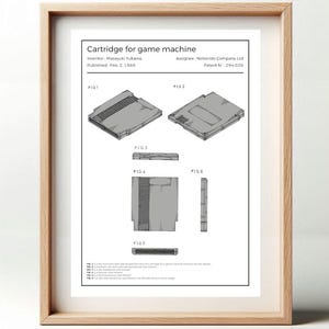 May include: A black and white line drawing of a Nintendo Entertainment System game cartridge. The drawing is a patent illustration with the title "Cartridge for game machine" and the inventor's name "Masayuki Yukawa".