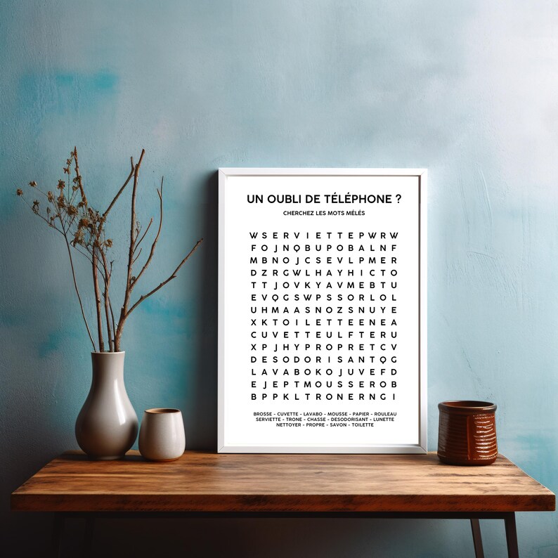 May include: A black and white printable word search puzzle with the title "Un Oubli de Telephone?" and the instructions "Cherchez les mots meles". The puzzle features a grid of letters with words related to bathroom items and personal hygiene.