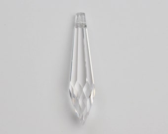 May include: A clear crystal teardrop pendant with a faceted design.