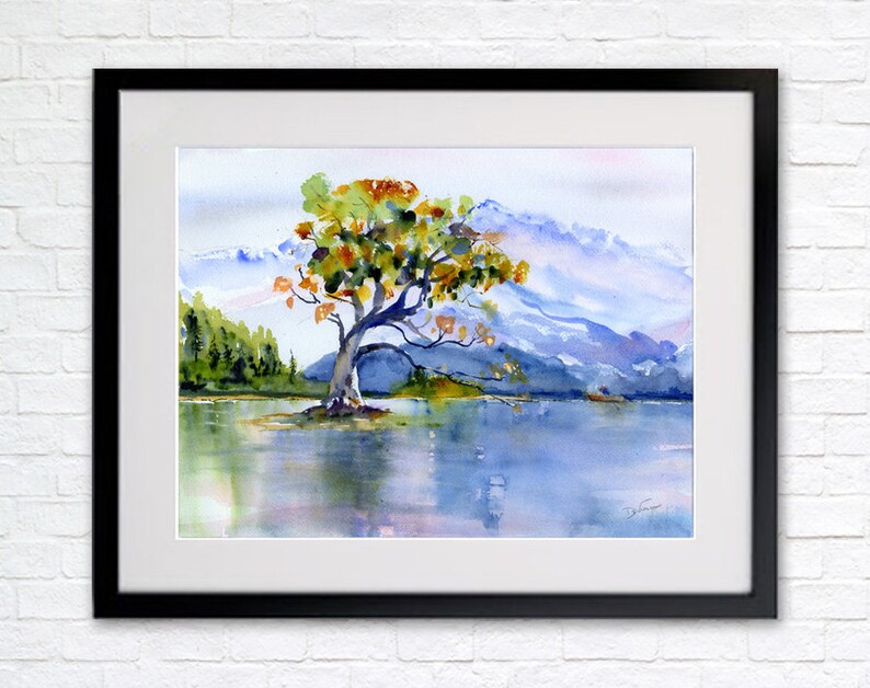 May include: Watercolour painting of a solitary tree with orange, yellow, and green leaves standing in a lake with mountains in the background.