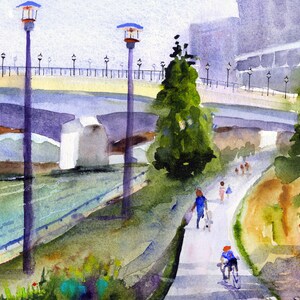 May include: A watercolor painting of a bridge over a river with people walking on a path beside it. The bridge is made of concrete and has a light yellow railing. There are trees and bushes on either side of the path. The sky is a light blue color.
