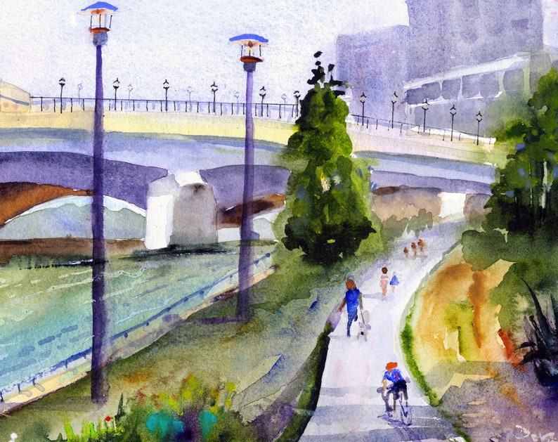 May include: A watercolor painting of a bridge over a river with people walking on a path beside it. The bridge is made of concrete and has a light yellow railing. There are trees and bushes on either side of the path. The sky is a light blue color.