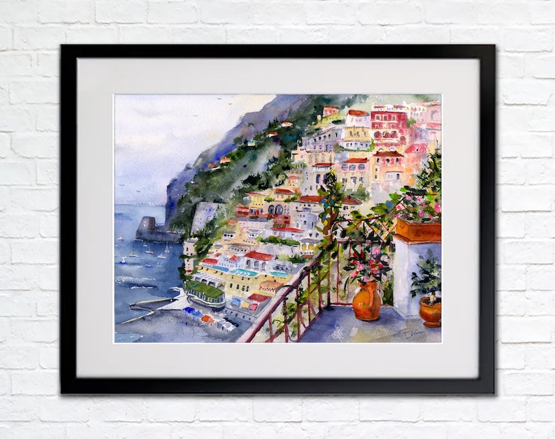 May include: Watercolor painting of a colorful Italian village built on a cliffside overlooking the sea. The painting features a balcony with potted plants and a view of the ocean and boats.