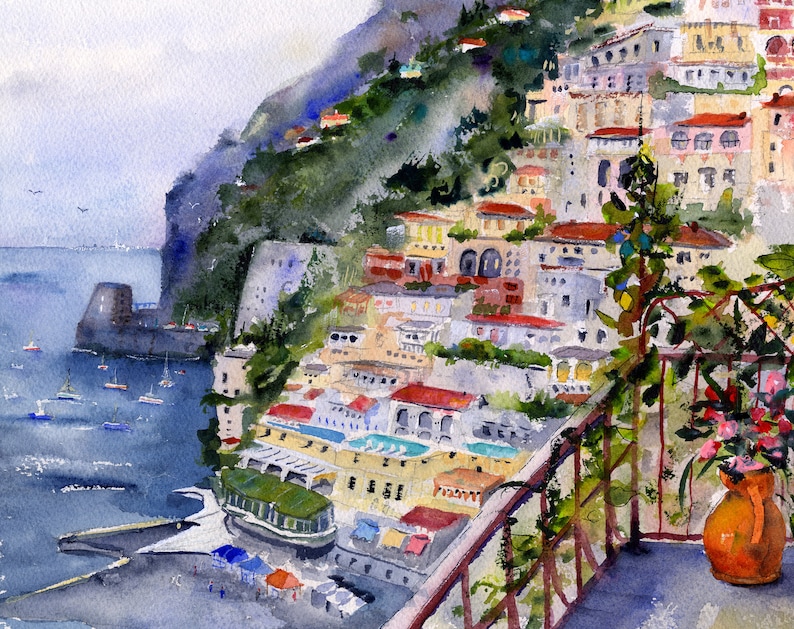 May include: A watercolor painting of a colorful Italian village built on a steep cliffside overlooking the ocean. The painting features a balcony with a potted plant and a view of the sea.