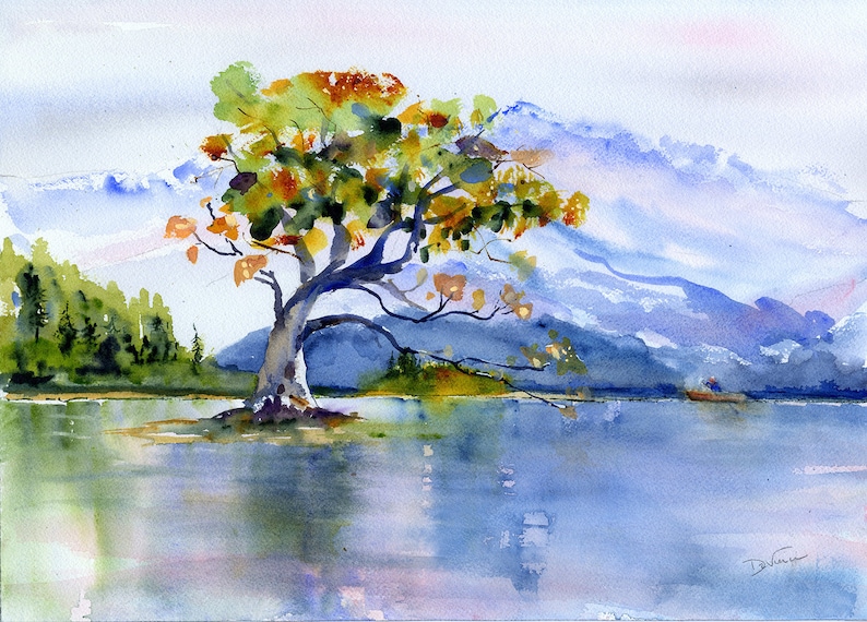 May include: Watercolour painting of a solitary tree with orange and green leaves on a small island in a lake. The background features a hazy blue mountain range.