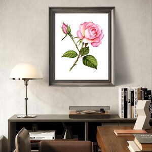 A realistic hand-painted watercolor of a blooming rose with delicate textures and natural gradients. The frame's rich, metallic finish complements the soft colors of the watercolor, adding a touch of luxury and refinement to the overall presentation.