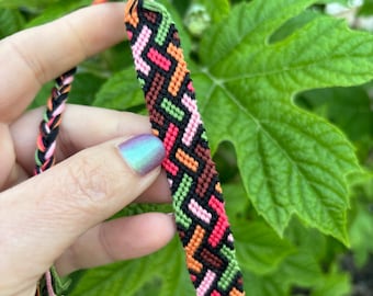 Friendship bracelet with weaving lines in green, pink, and orange - handmade macrame jewelry - made in USA