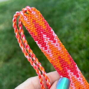 Friendship bracelet in ombré orange flame