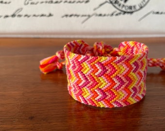 Wide Chevron Friendship Bracelet in bright hues of pink, orange, & yellow - handmade macrame cuff bracelet