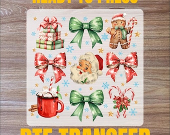 May include: A sheet of white DTF transfer film with a variety of Christmas-themed images, including a gingerbread man, Santa Claus, bows, presents, candy canes, and a mug of hot chocolate. The text "READY TO PRESS" is at the top of the sheet and "DTF TRANSFER" is at the bottom.