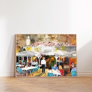 May include: A watercolour painting of a restaurant called "Dinkums" with outdoor seating. The restaurant has a terracotta roof and is surrounded by colourful umbrellas. People are sitting at tables and enjoying drinks and food. The painting has a vintage feel and is framed in a wooden frame.