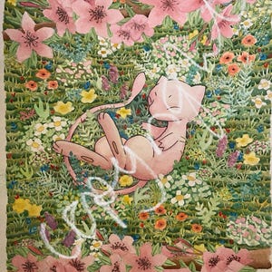 May include: A watercolour painting of a pink cartoon cat lying in a field of flowers. The flowers are a variety of colours, including pink, yellow, blue, and purple. The cat is surrounded by green grass and leaves. The painting is signed "Leanda H" in the bottom right corner.