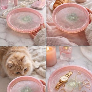May include: A pink resin tray with a glittery centre and a beaded edge. The tray is shown with jewellery, a watch, and other accessories. The tray is approximately 20 cm in diameter.