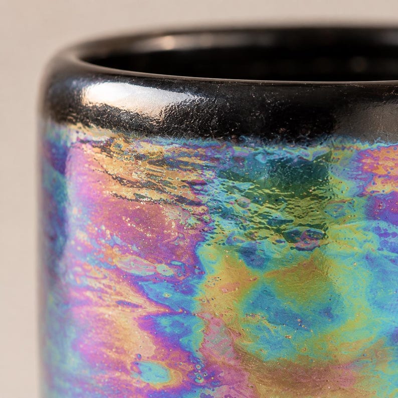 Close-up of the handmade iridescent pearl lustre showing blue, green, purple, pink and gold variations