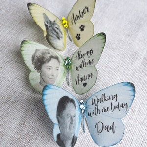 Customised little silk butterfly keepsakes, a pale yellow with an image of a cat and the name Amber. A something blue butterfly with the image of a man and the words Walking with me today Dad