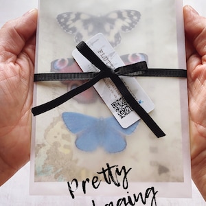 This image shows pretty packaging, all my butterflies are sent on glossy gift cards, tucking into vellum paper envelops and tied with satin ribbon. They make lovely gifts!
