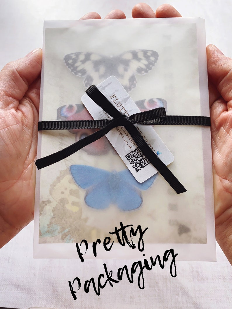This image shows pretty packaging, all my butterflies are sent on glossy gift cards, tucking into vellum paper envelops and tied with satin ribbon. They make lovely gifts!