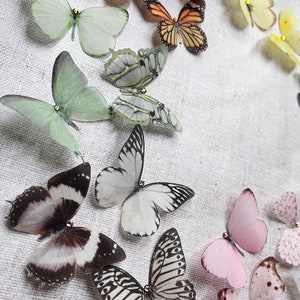 Small hand cut silk butterflies in soft pastel colours. Super realistic, just like real butterflies. Pretty bridal wedding hair accessories, each on cut from fine delicate silk. Fluttery and soft.