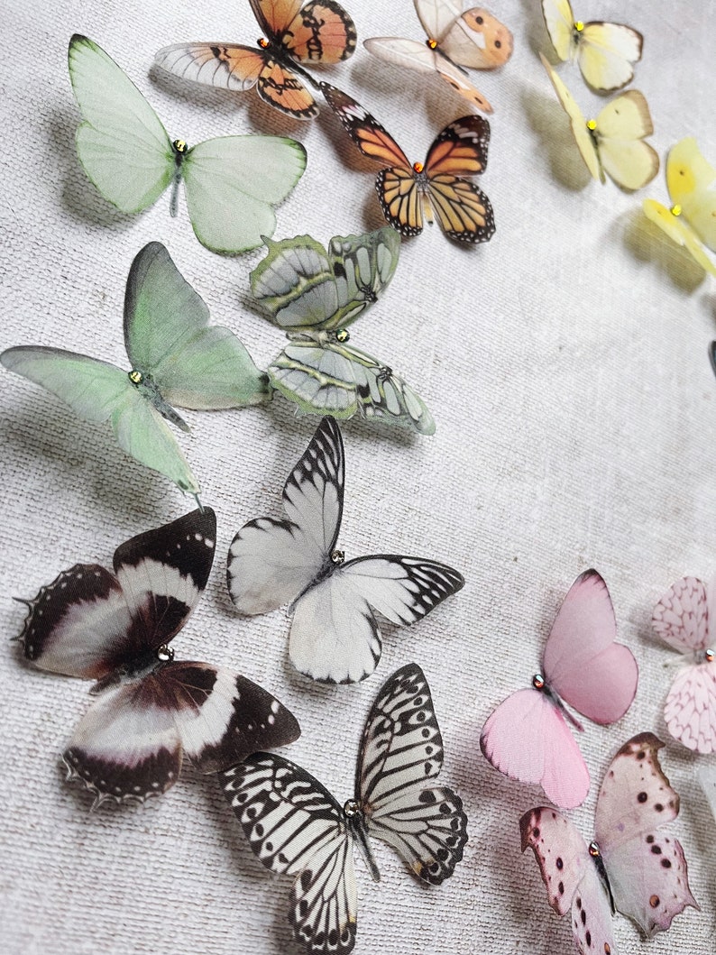 Small hand cut silk butterflies in soft pastel colours. Super realistic, just like real butterflies. Pretty bridal wedding hair accessories, each on cut from fine delicate silk. Fluttery and soft.