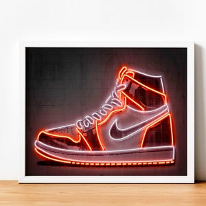 May include: A neon sign of a white and red high-top sneaker with a black swoosh on a dark gray background.