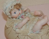 Porcelain Baby on an Egg Trinket Box