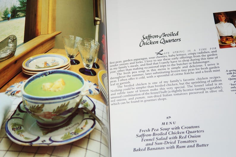 May include: A cookbook page with a recipe for Saffron-Broiled Chicken Quarters. The page includes a photo of a bowl of green pea soup with croutons, a menu listing the recipe, and a description of the dish.