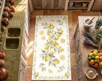 May include: A rectangular kitchen floor mat featuring a cream-colored background with a central botanical illustration of yellow lemons, green leaves, and white blossoms, framed by a delicate border of olive branches and scattered lemon slices.