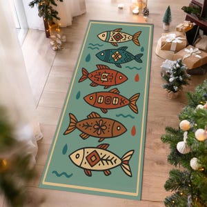 May include: A rectangular teal rug featuring a repeating pattern of stylized fish in shades of orange, brown, and cream. Each fish has unique geometric designs. The rug has a cream border and is decorated with water droplet and wave motifs.