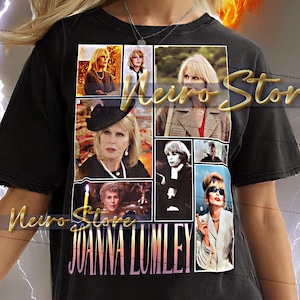 May include: Black unisex t-shirt featuring a collage of images of Joanna Lumley, with her name in pink and purple text. The shirt has a distressed look and is worn by a model.