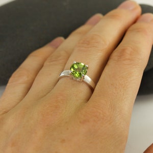 Solid sterling silver peridot gemstone ring by Lotus Stone Jewelry on model
