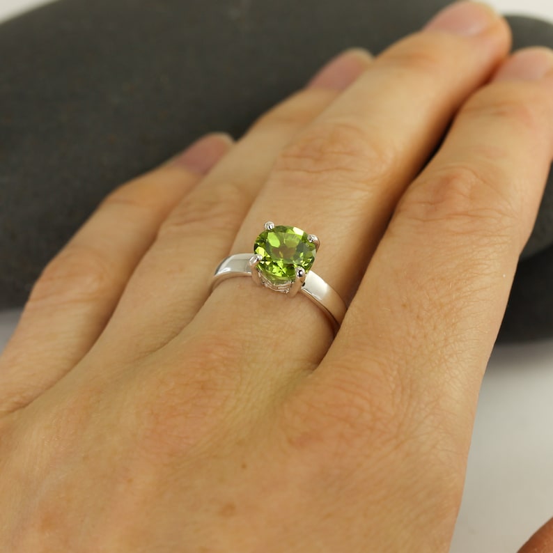 Solid sterling silver peridot gemstone ring by Lotus Stone Jewelry on model